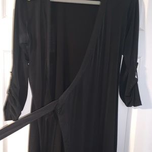 Wrap around Calvin Klein black dress .